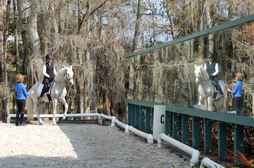 Riding in front of a large mirror.